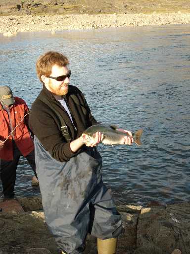 matt holding fish caught with first cast of new rod