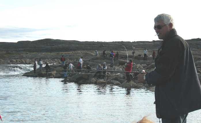 crowd of fishers at sylvia grinnell falls