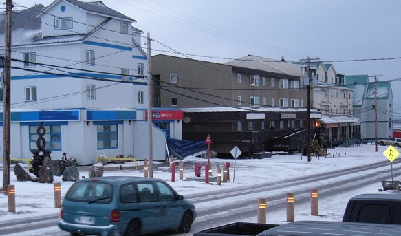 pedestrian walkway posts being 
installed in front of post office