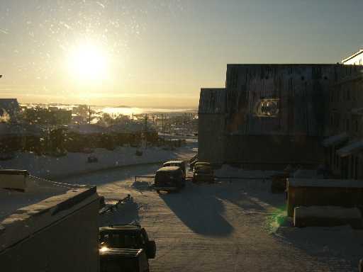 bright iqaluit sunrise overlooking bay